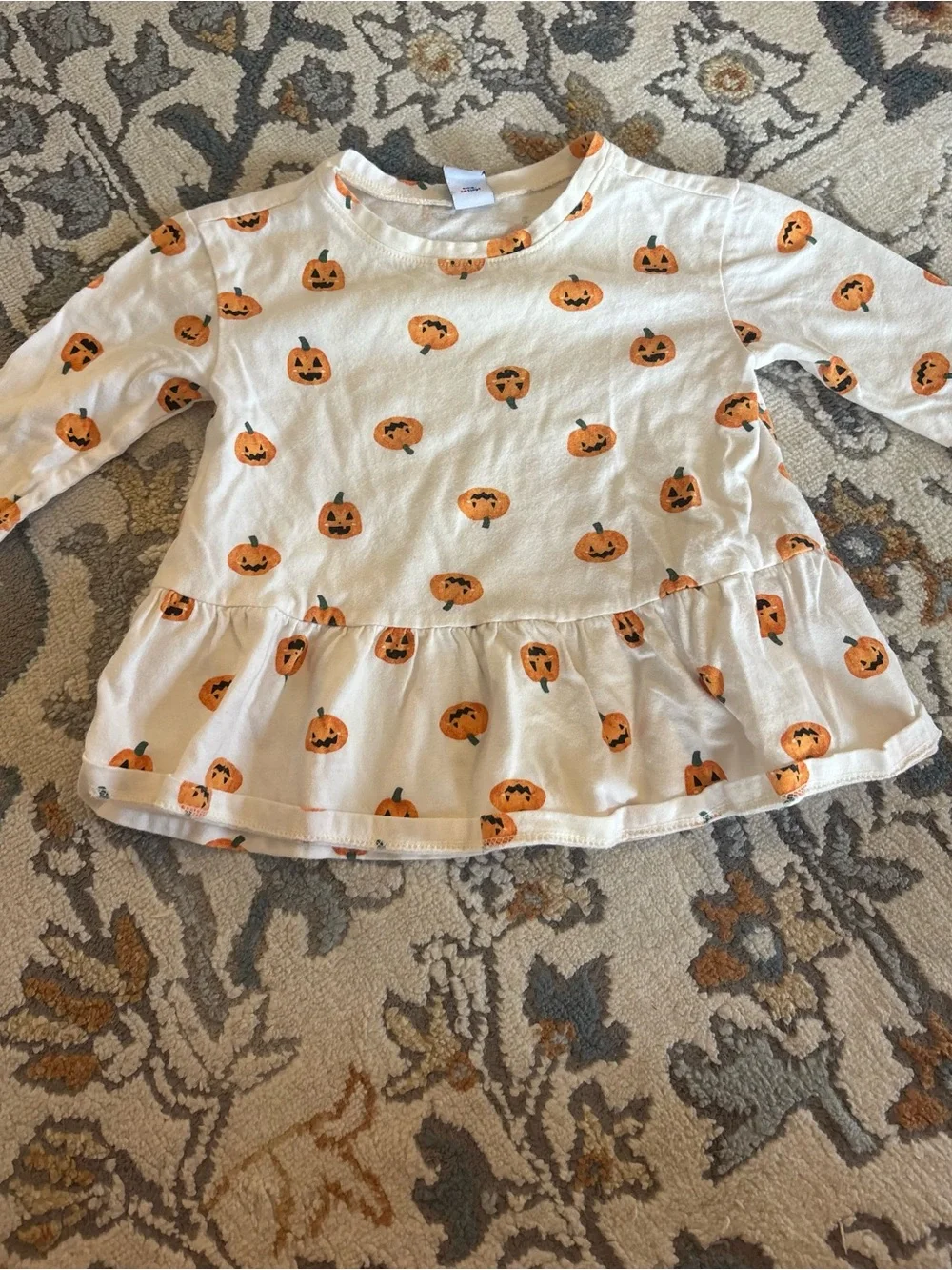 White Long-Sleeve Ruffled Top with Orange Pumpkin Print